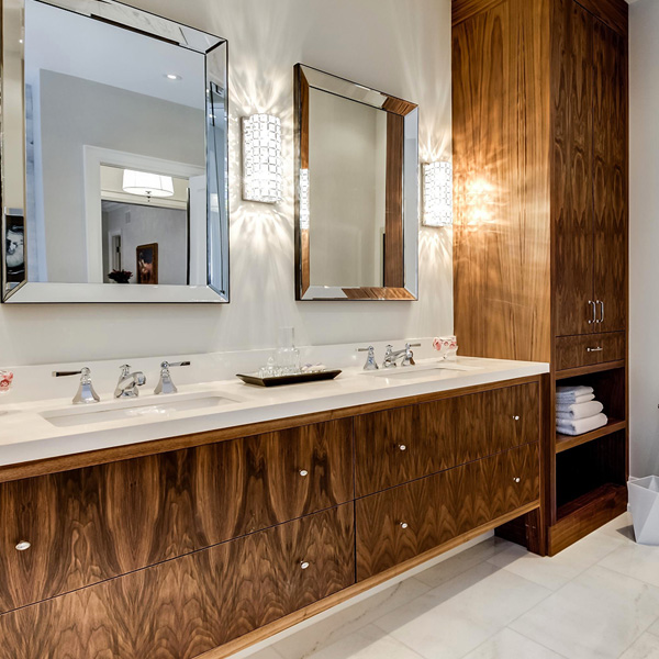 Bathroom with walnut builtin cabinets